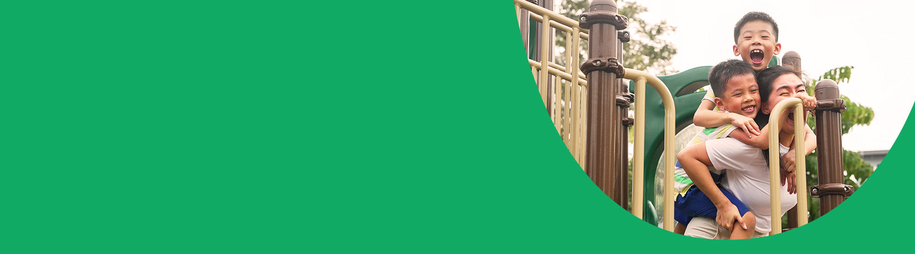 Adult playing with children on a playground, showcasing vibrant spaces that foster community, connection, and intergenerational play.