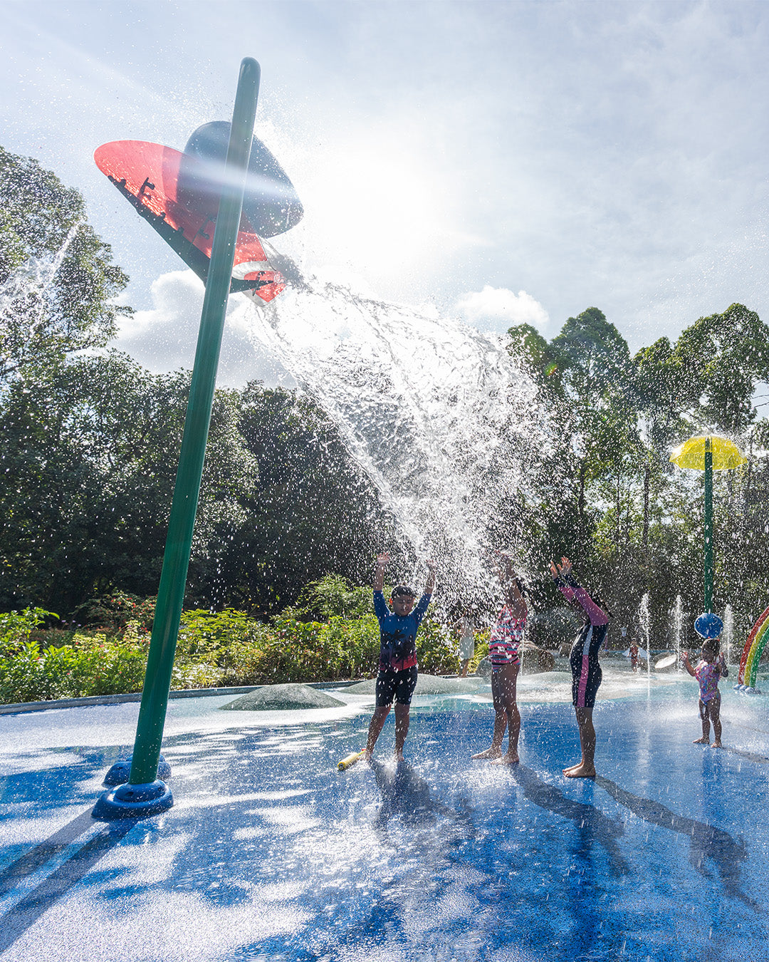 Jacob Ballas Children's Garden features a giant tipping water bucket, creating an exciting cascade for water play.