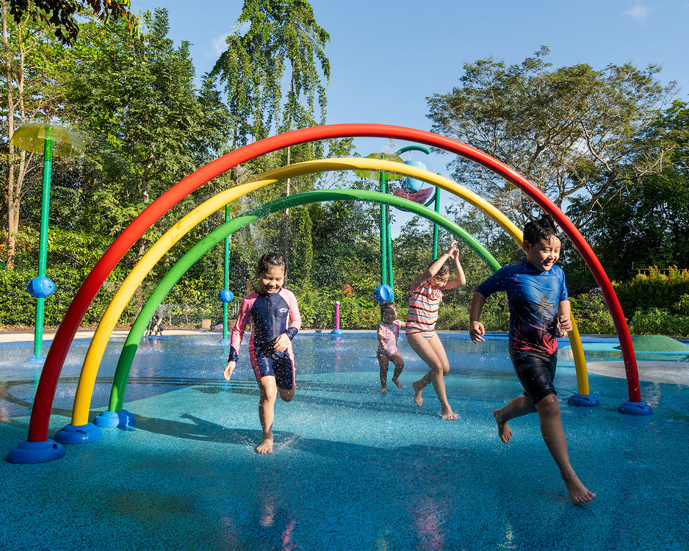 Vortex International rainbow arches and sculpted mounds at Jacob Ballas, teaching hydrodynamics through water play.
