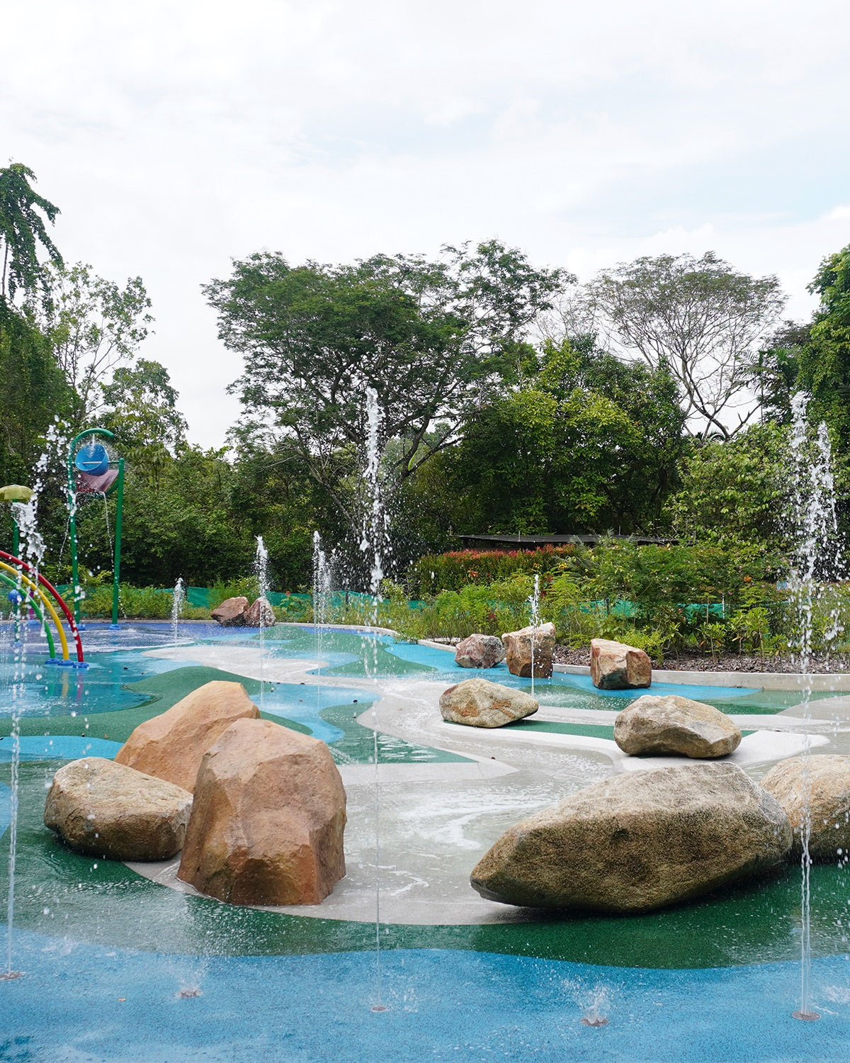 Jacob Ballas Children's Garden featuring reused boulders, promoting sustainability in landscaping and play design.