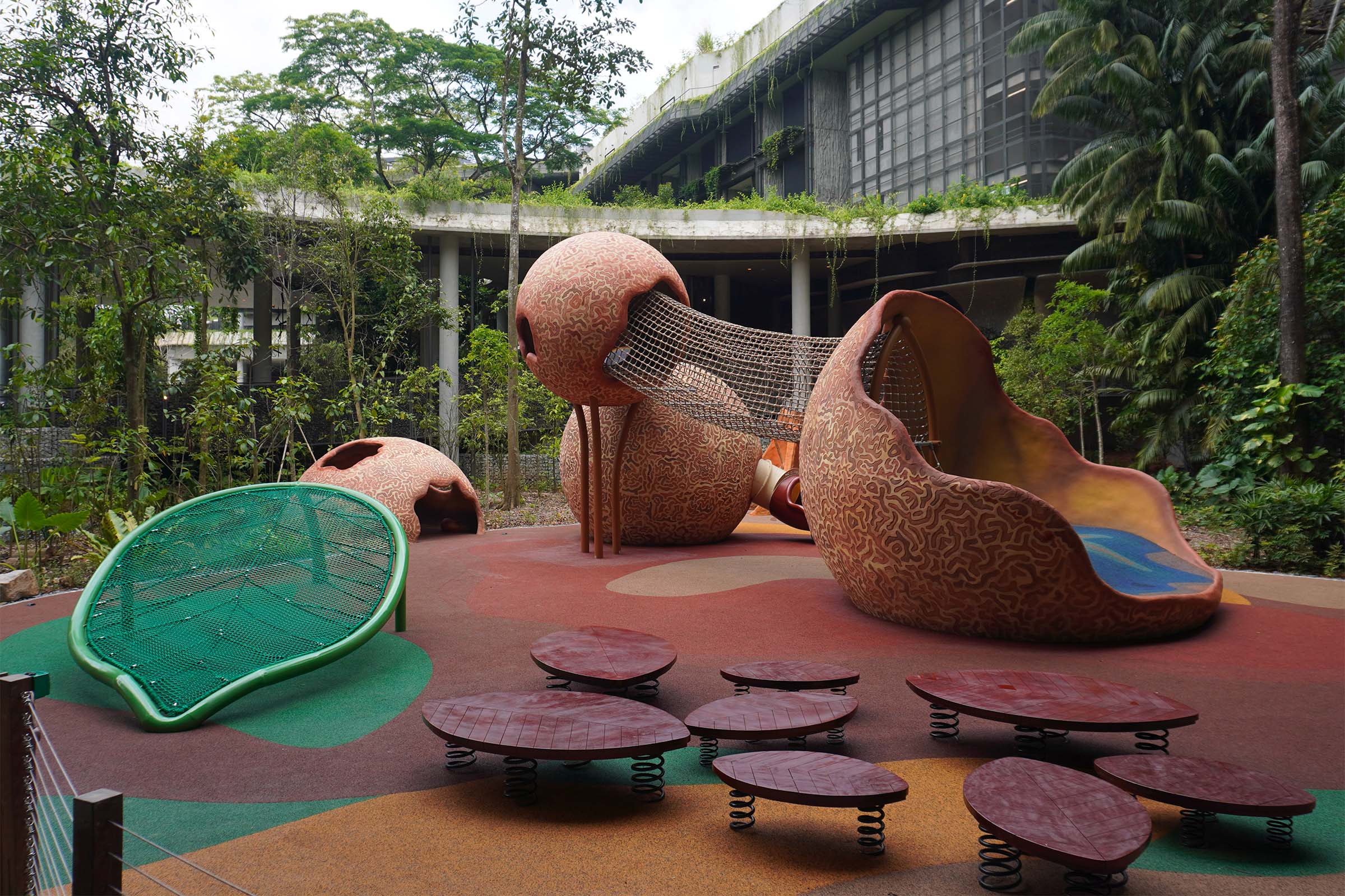 Mandai Rainforest Resort playground is designed like a cannonball fruit tree with elements to climb, crawl, and slide.