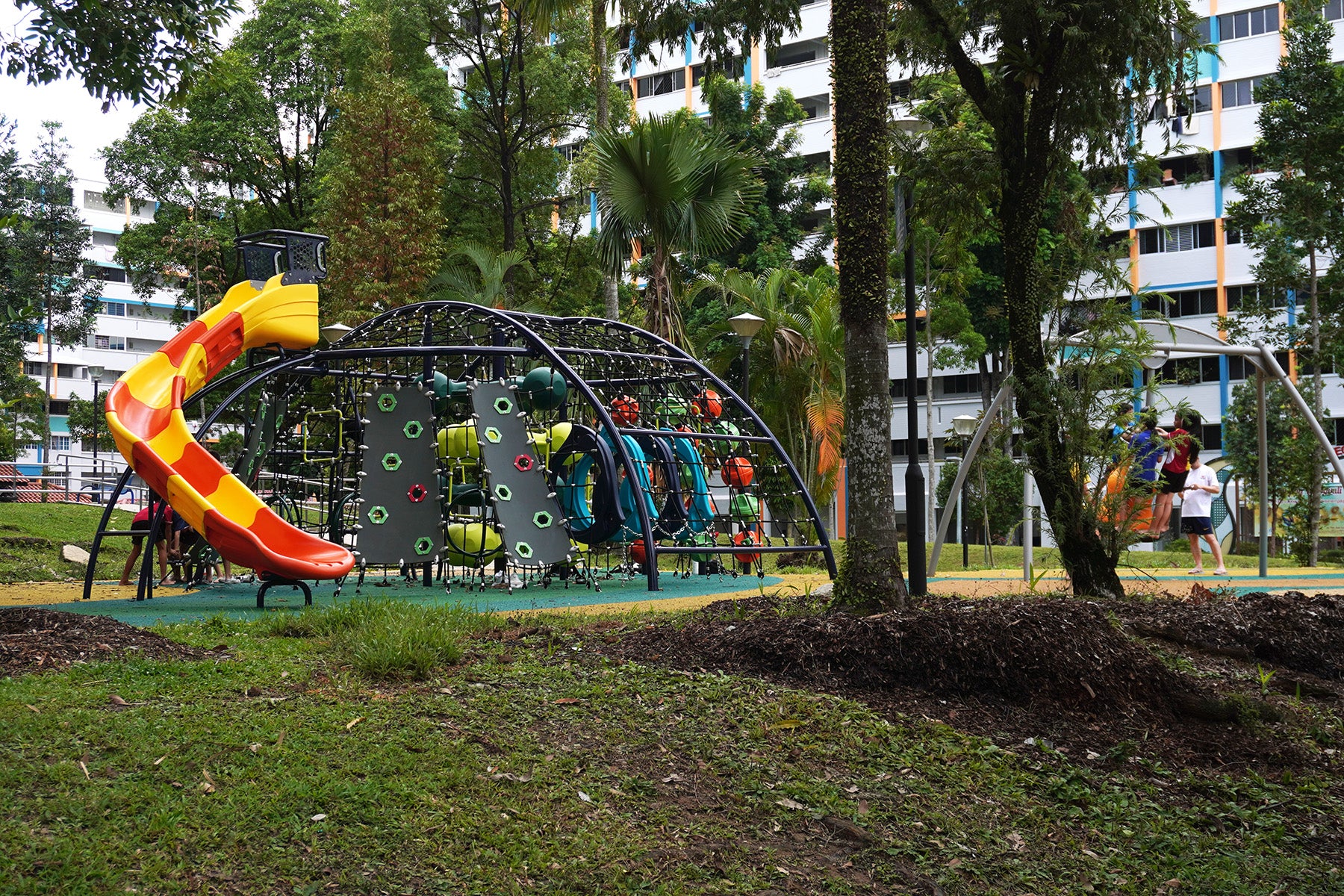 Teck Whye Garden playground features a dome-shaped climbing structure and a bell swing for safe, fun, and dynamic play.