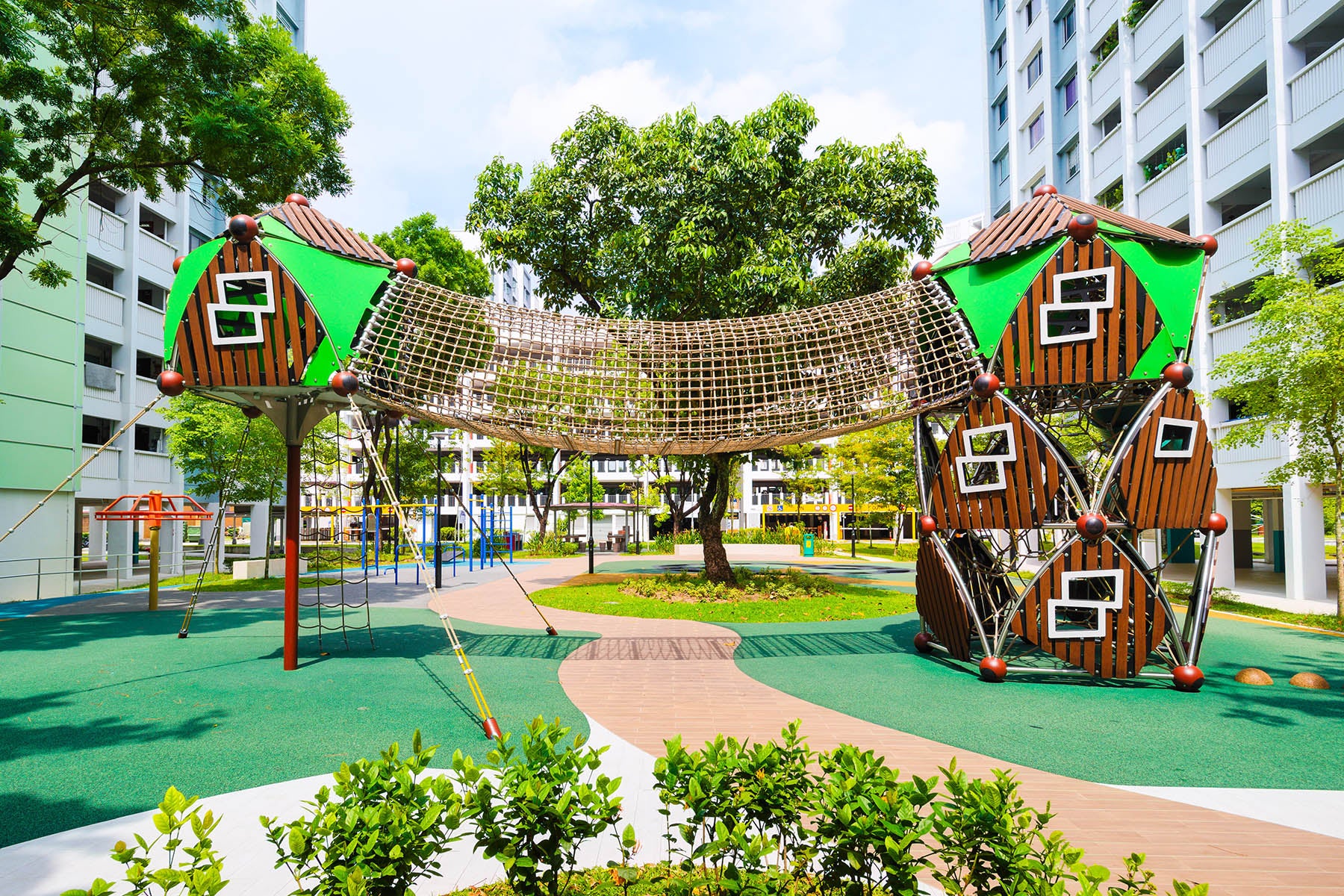 Berliner playground at Yishun Avenue 6 features a sturdy rope ladder, tunnel bridge, and an exciting tunnel slide.