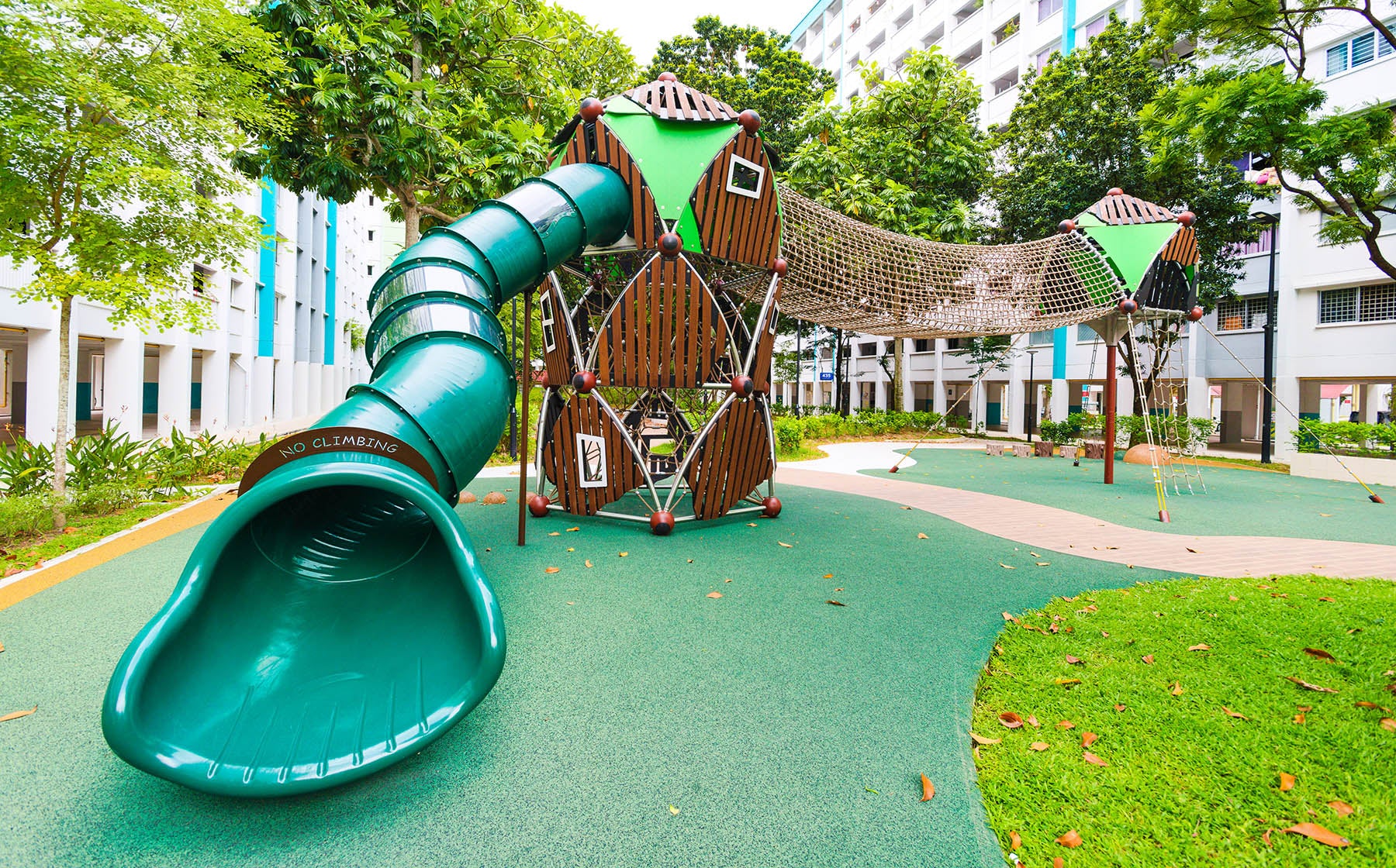 Berliner playground at Yishun Avenue 6 features a sturdy rope ladder, tunnel bridge, and an exciting tunnel slide.