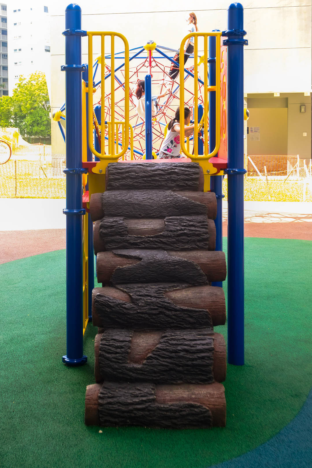 ACS (Junior) playground with a Playworld logged stairway, promoting physical activity and motor skill development.