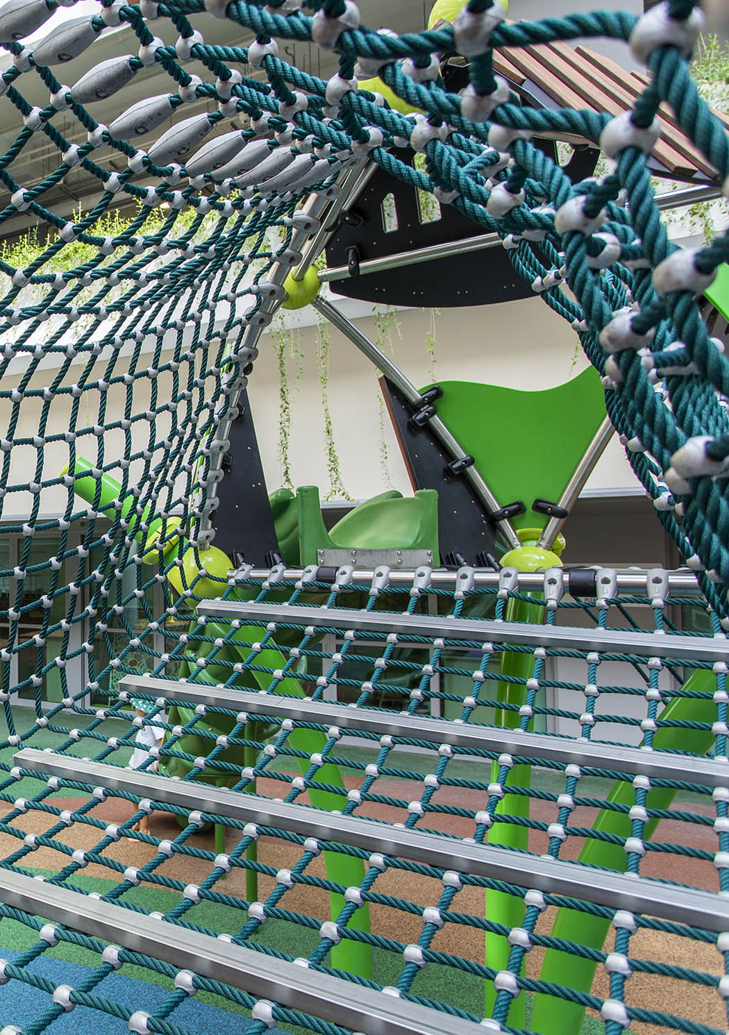 Berliner Treehouse bridge is a thrilling roped pathway that enhances children's motor skills as they navigate it.