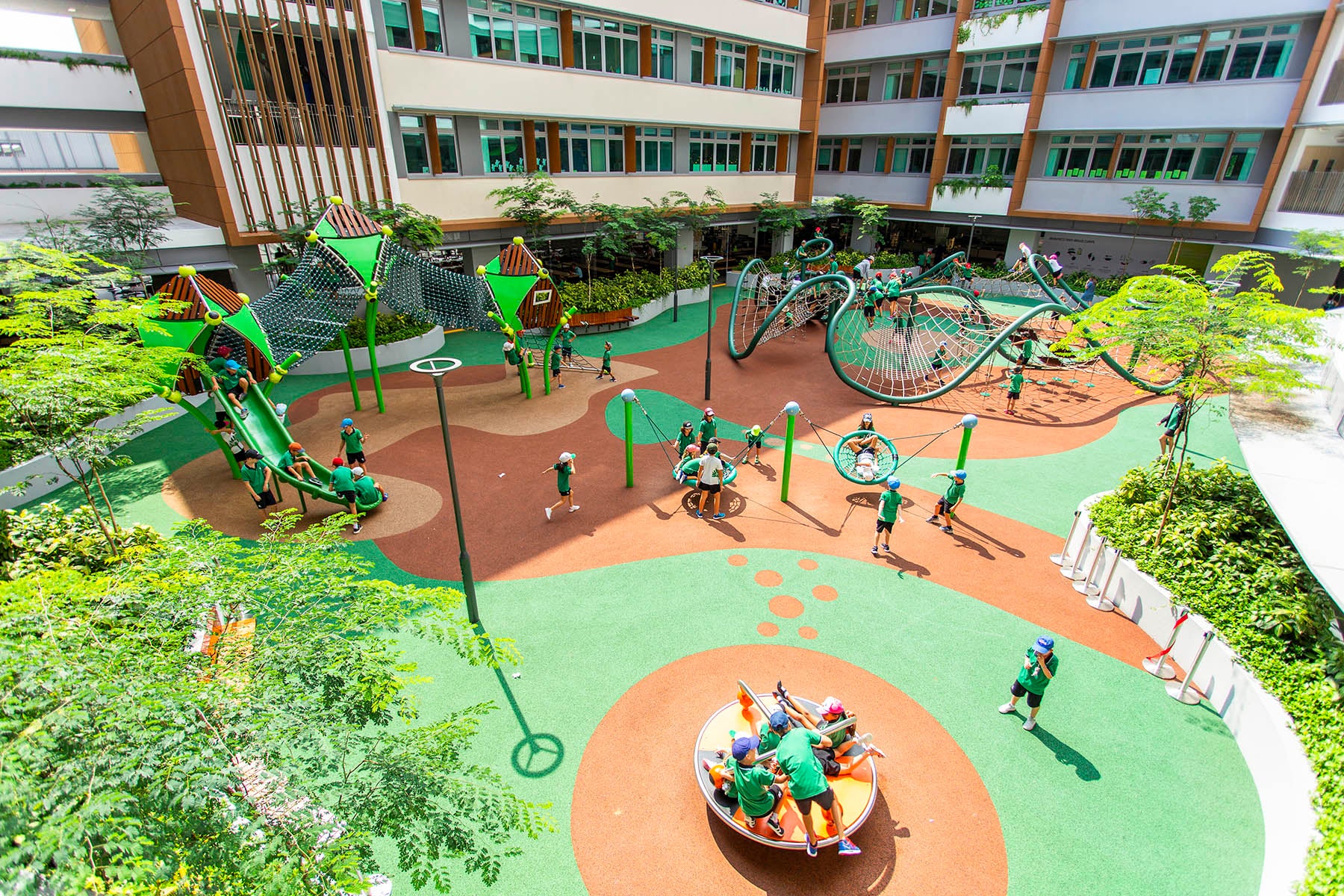 German European School playground with Berliner equipment, fostering fun, motor skill development, and problem-solving.