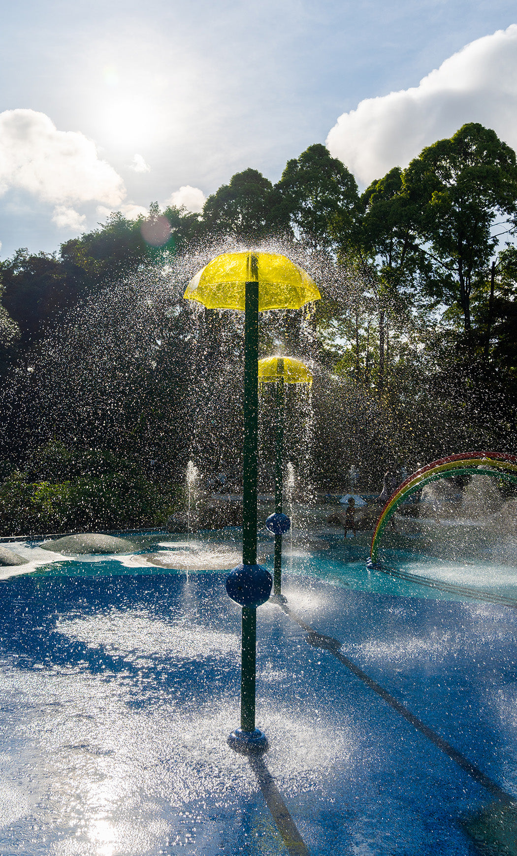 Vortex International's umbrella-shaped water feature at Jacob Ballas Children's Garden, creating a gentle water effect.