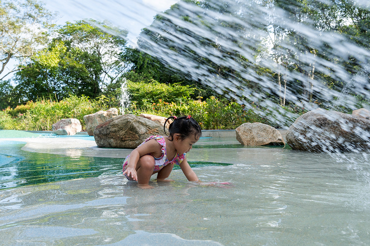 Jacob Ballas Children's Garden playground with a shallow pool for safe and enjoyable water play fun.