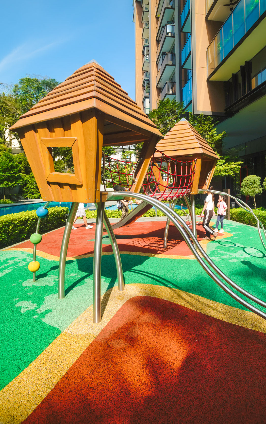 Stilum play combination with climbing balls, wobble bridge, playhouses, and slide for active, imaginative fun.