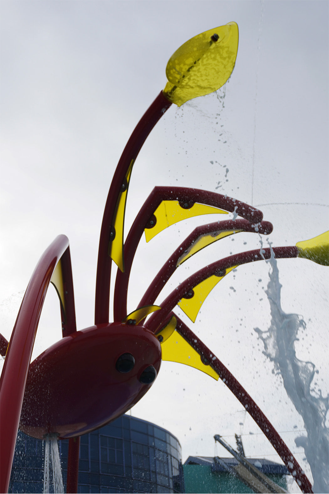 Innovative Singapore water playground featuring a large red spider sprayer and interactive aquatic play equipment.