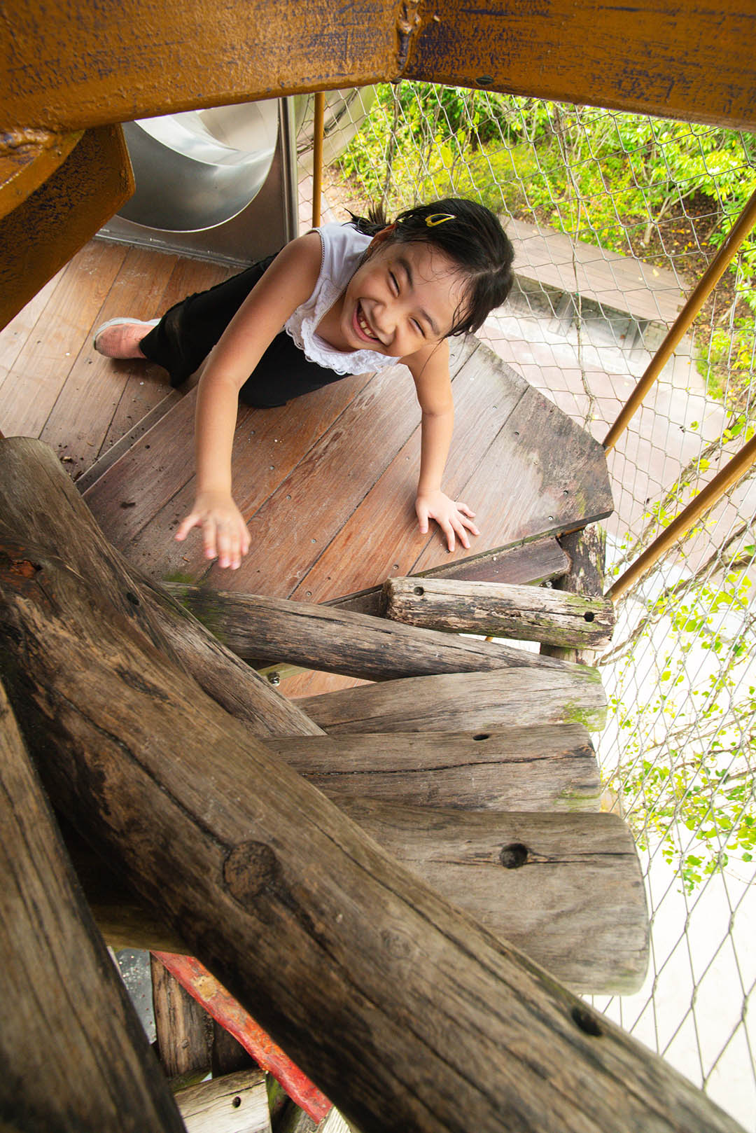 Snake Play zone features a towering wooden structure for climbing and sliding, mimicking a slithering snake.