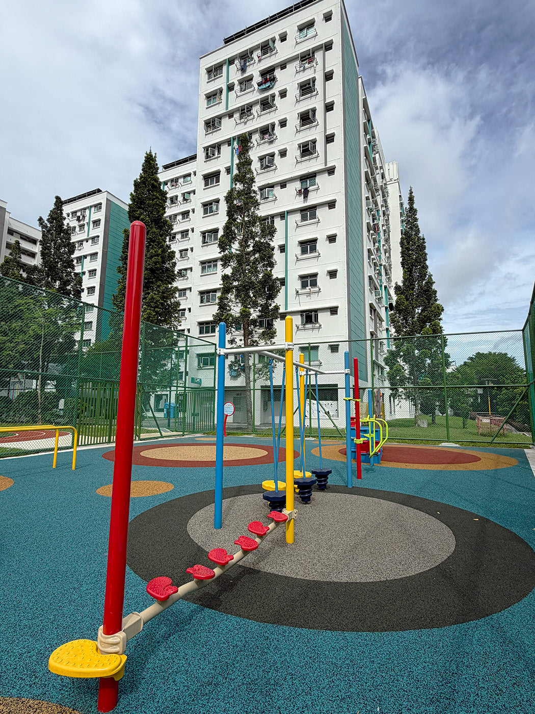 Jurong Primary School playground offers sturdy equipment for students to develop hand-eye coordination skills safely.