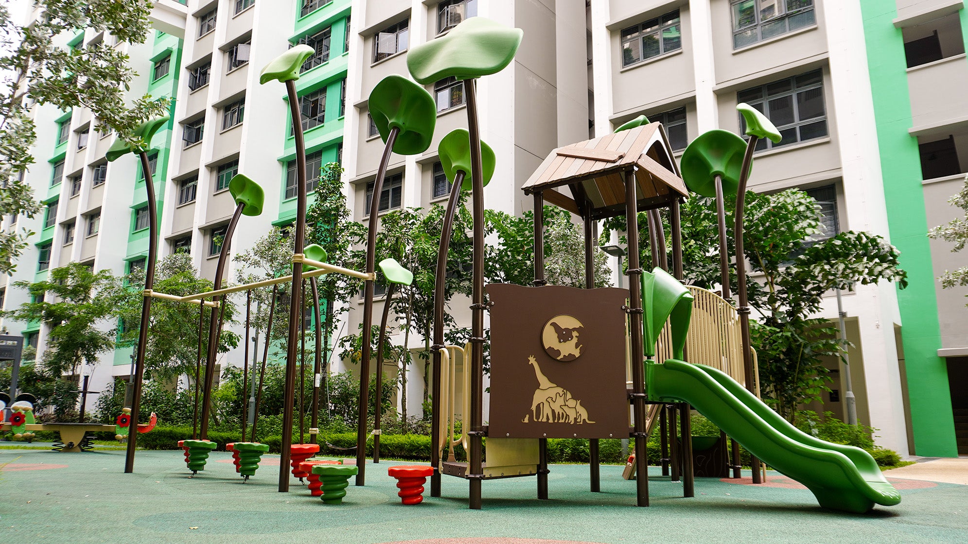 Playworld playground features play panels and equipment for sliding, jumping, and an obstacle course for children.