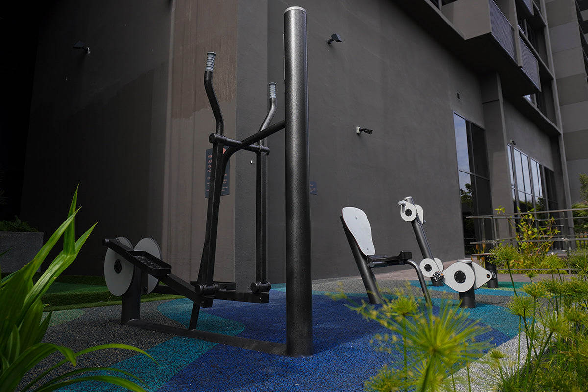 Outdoor elliptical bike and dual bicycle fitness station supporting smooth full-body cardio and low-impact movement.