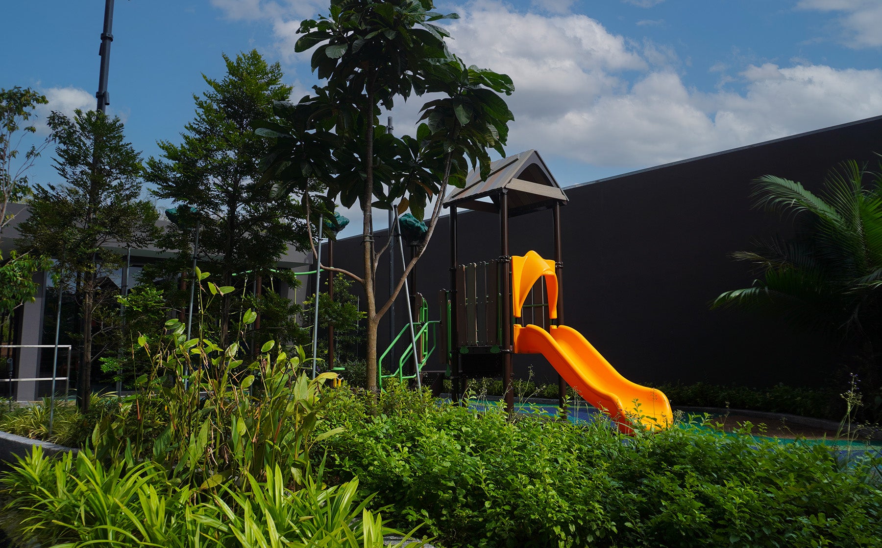 Lentor Modern treehouse playground blends with natural surroundings, offering immersive and nature-inspired play.
