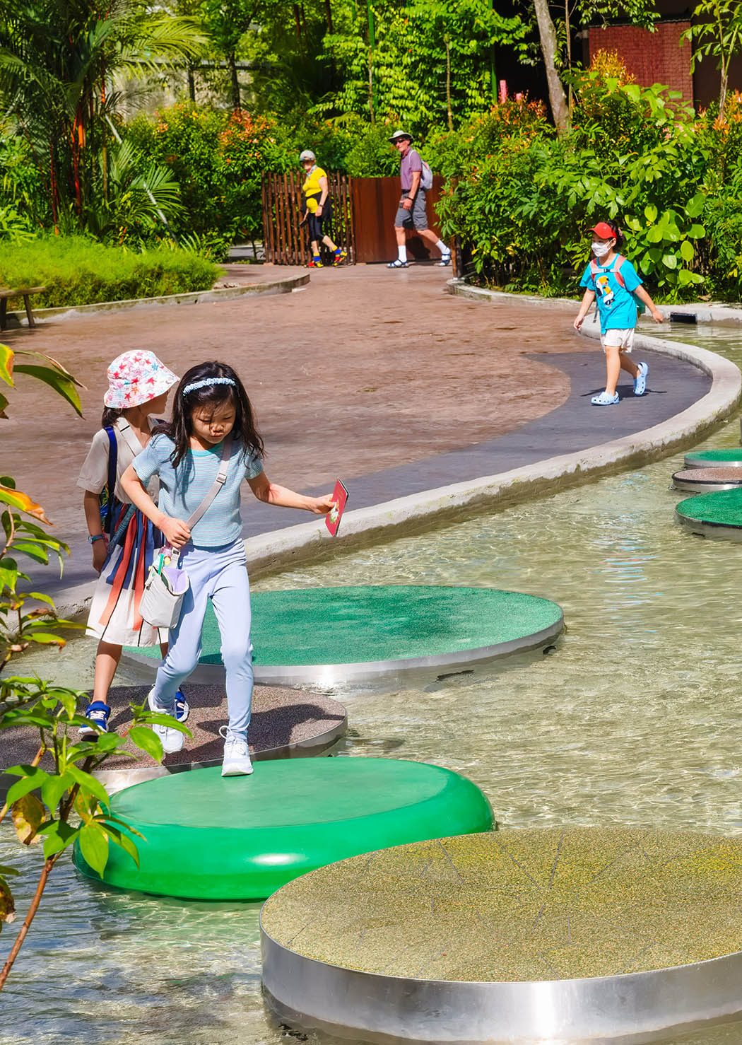 Mandai Bird Paradise Lilypad Hop features giant lily pads for kids to leap, enhancing balance and imaginative play.