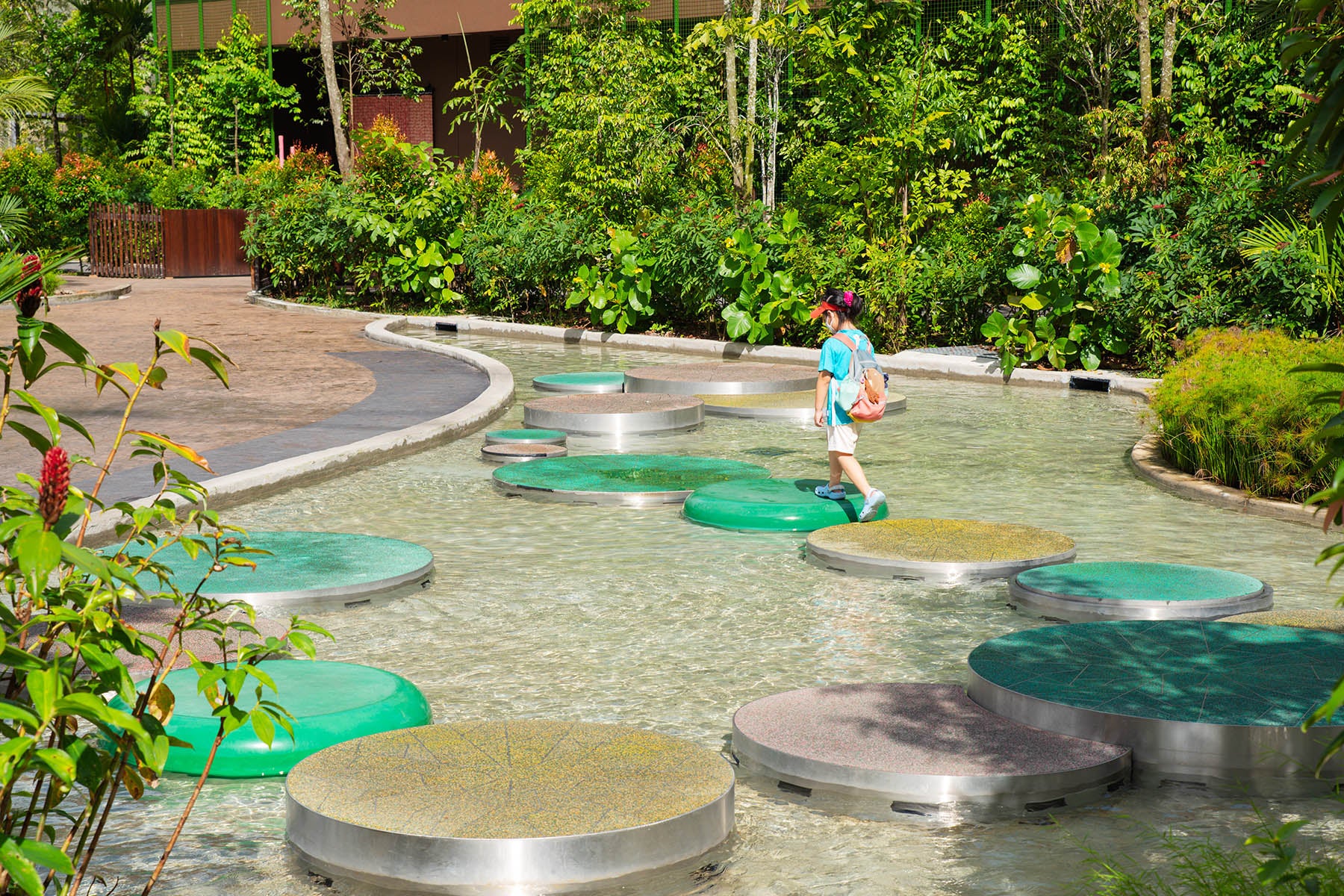 Mandai Bird Paradise Lilypad Hop features giant lily pads for kids to leap, enhancing balance and imaginative play.