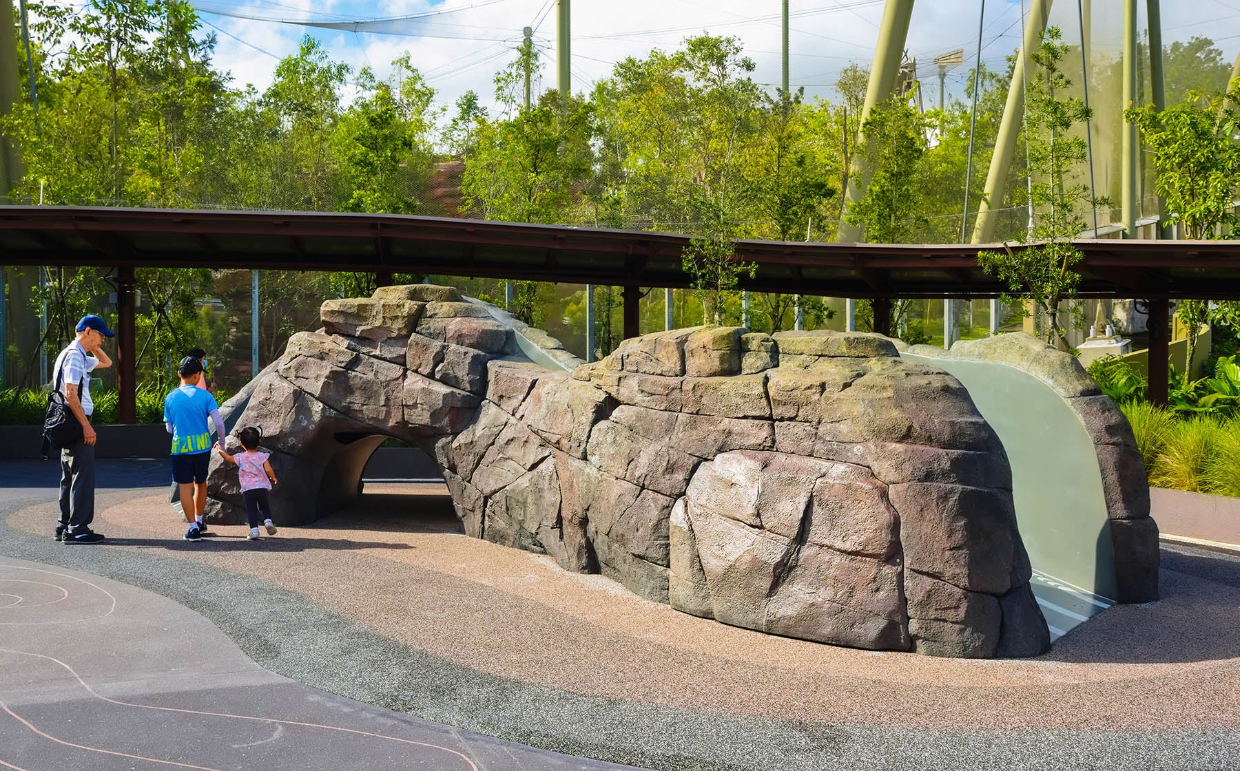 Pangolin-inspired rock sculpture with integrated slide, combining nature's beauty and safe, engaging play for children.