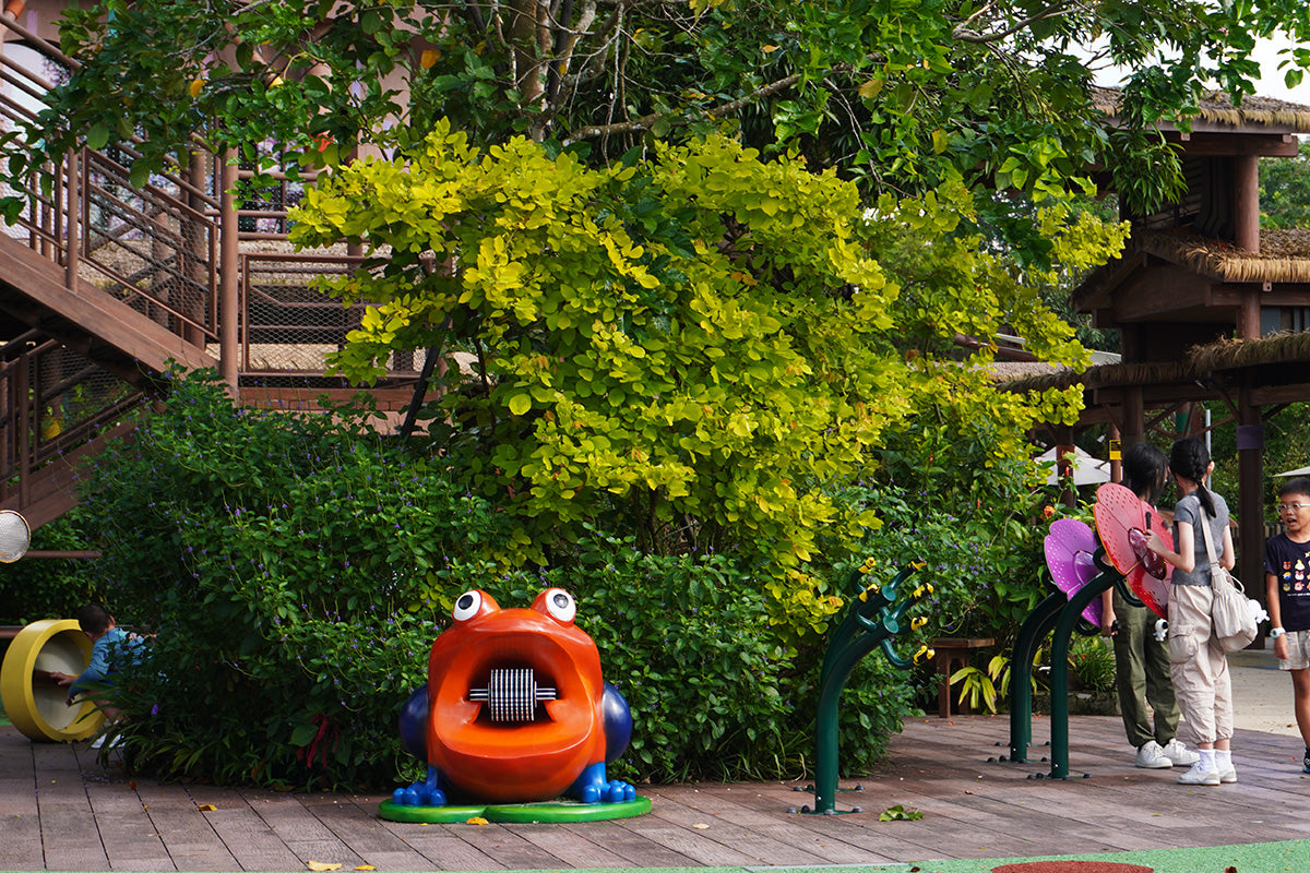 Mandai KidzWorld playground with frog-themed equipment, spinning mechanisms, and realistic croaking sounds for fun play.