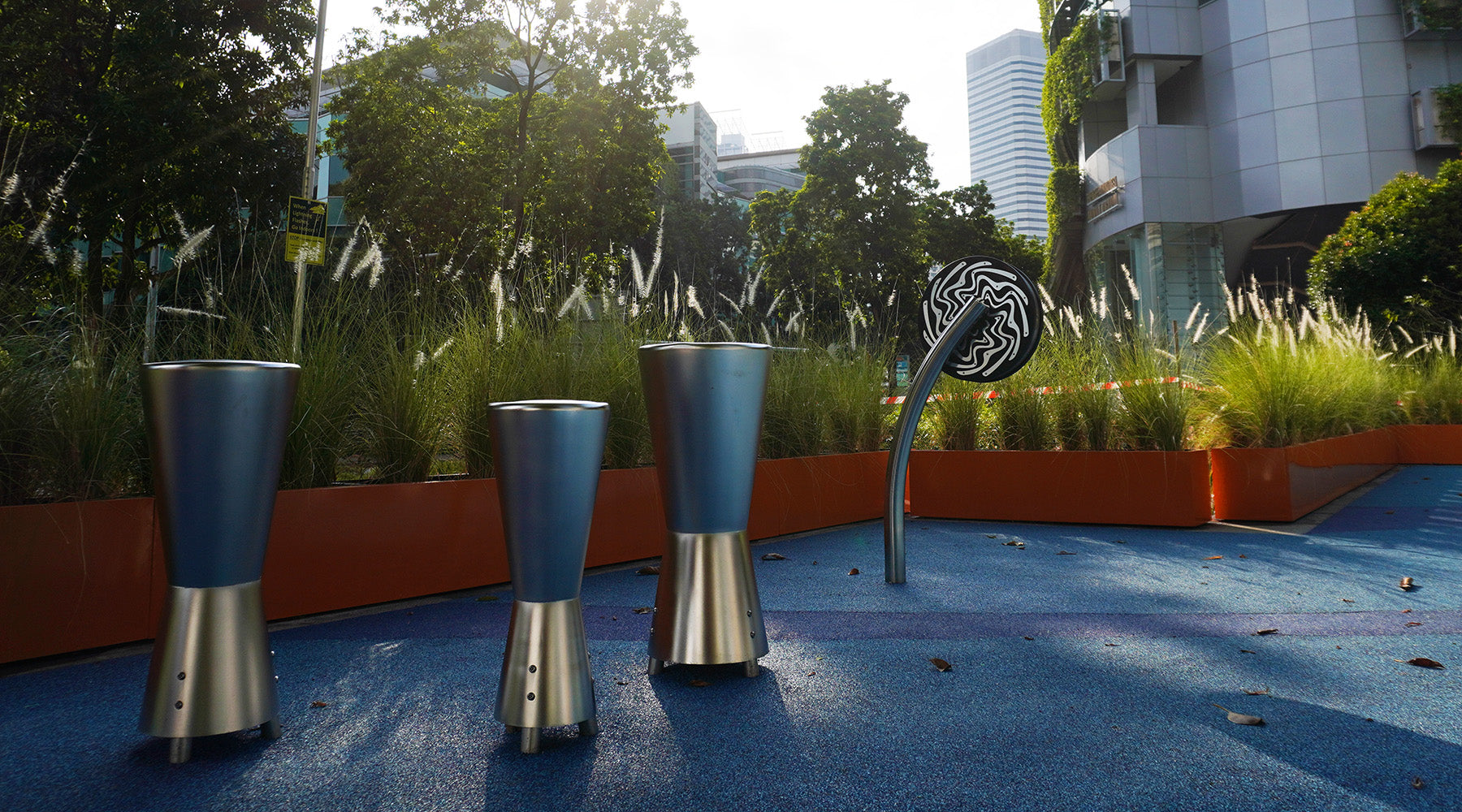 Percussion Play equipment enables children to create musical rhythm by spinning the Cyclone or striking the Djembe.