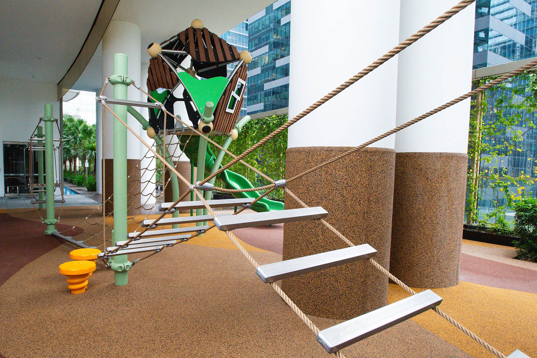One Shenton playground featuring Berliner equipment with rope play, hopping, and a Greenville play set for active fun.