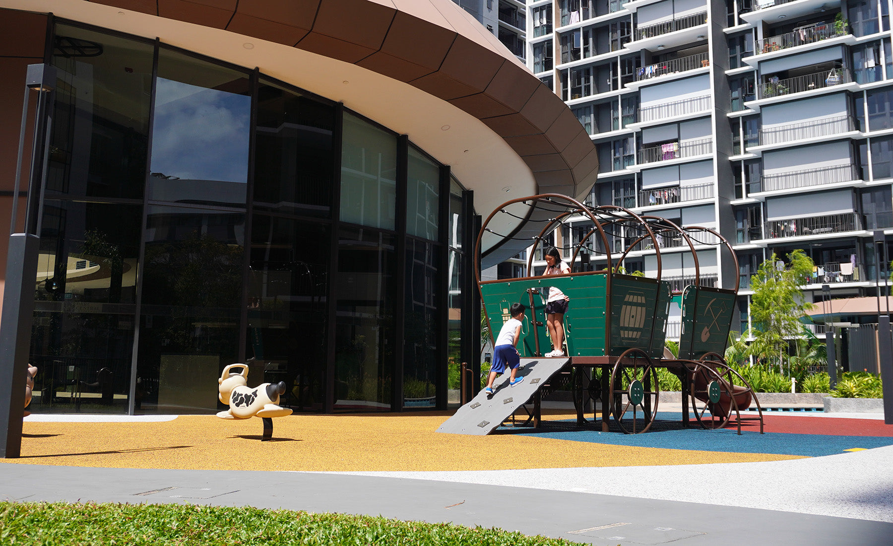 Parc Central Residence features a Playworld Horse & Carriage playground, offering whimsical fun with elegant design.