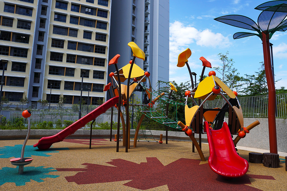 Berliner Greenville play towers are linked by a rope bridge with slides and climbing routes for active play.