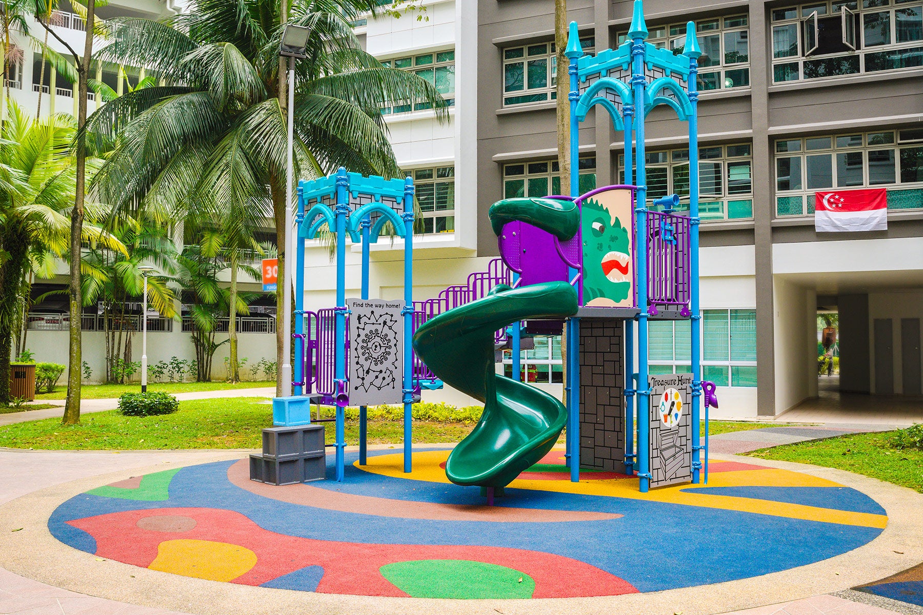 Dragon-themed Punggol CoralTree playground with play panels, slides, and climbing squares for imaginative play.