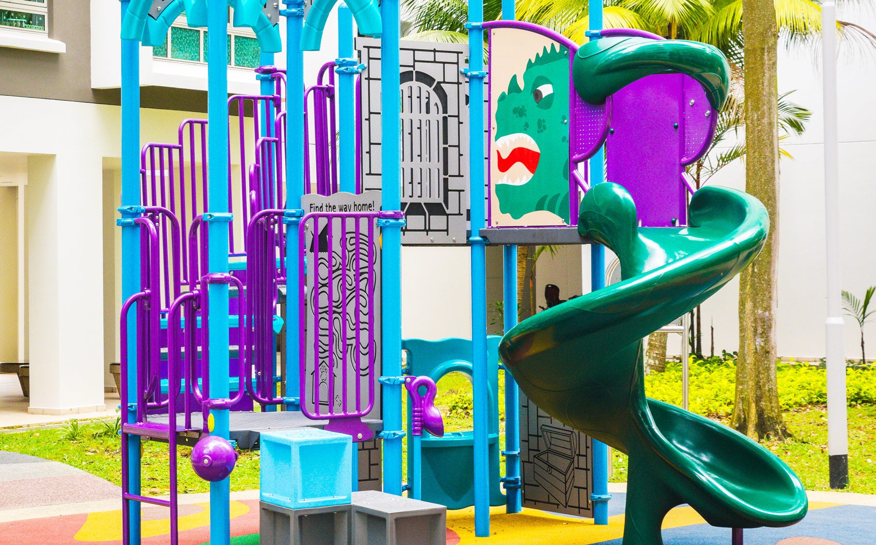 Dragon-themed Punggol CoralTree playground with play panels, slides, and climbing squares for imaginative play.