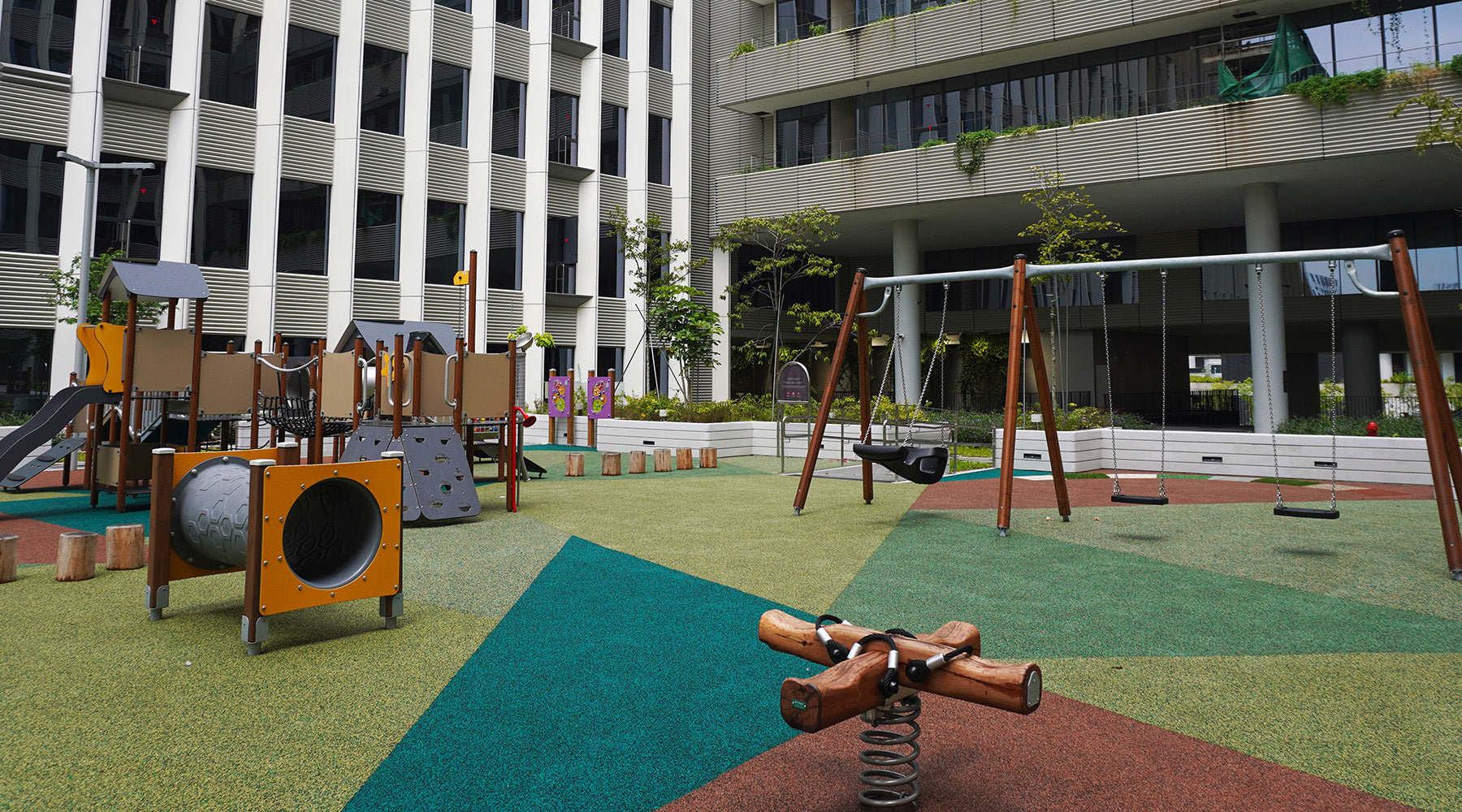 Punggol Digital District playground features a four-person spring rocker, swings and tandem swings for active play.