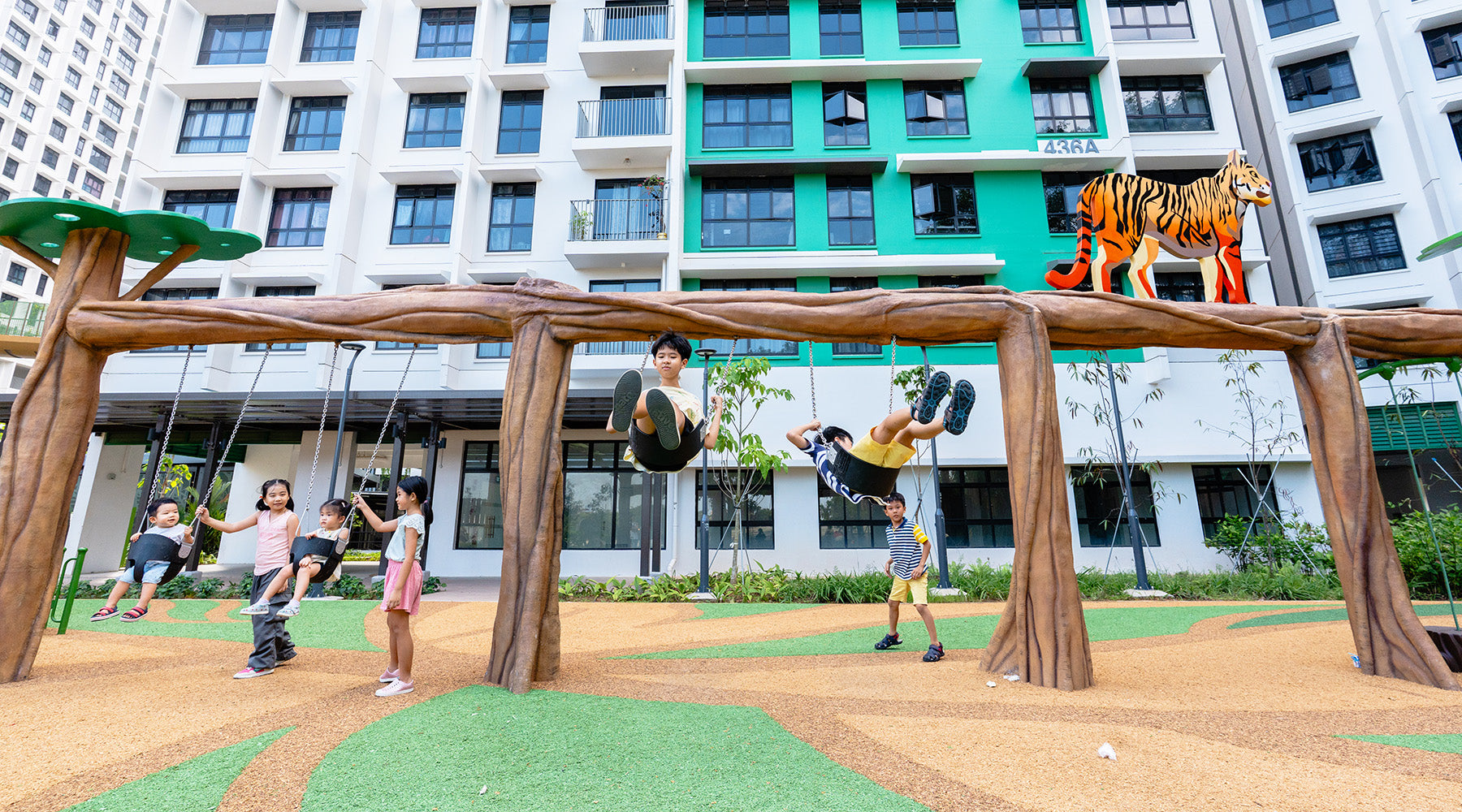 Punggol Point Crown animal-themed playground with swings and a panel of Apay the Bengal Tiger for engaging themed play.
