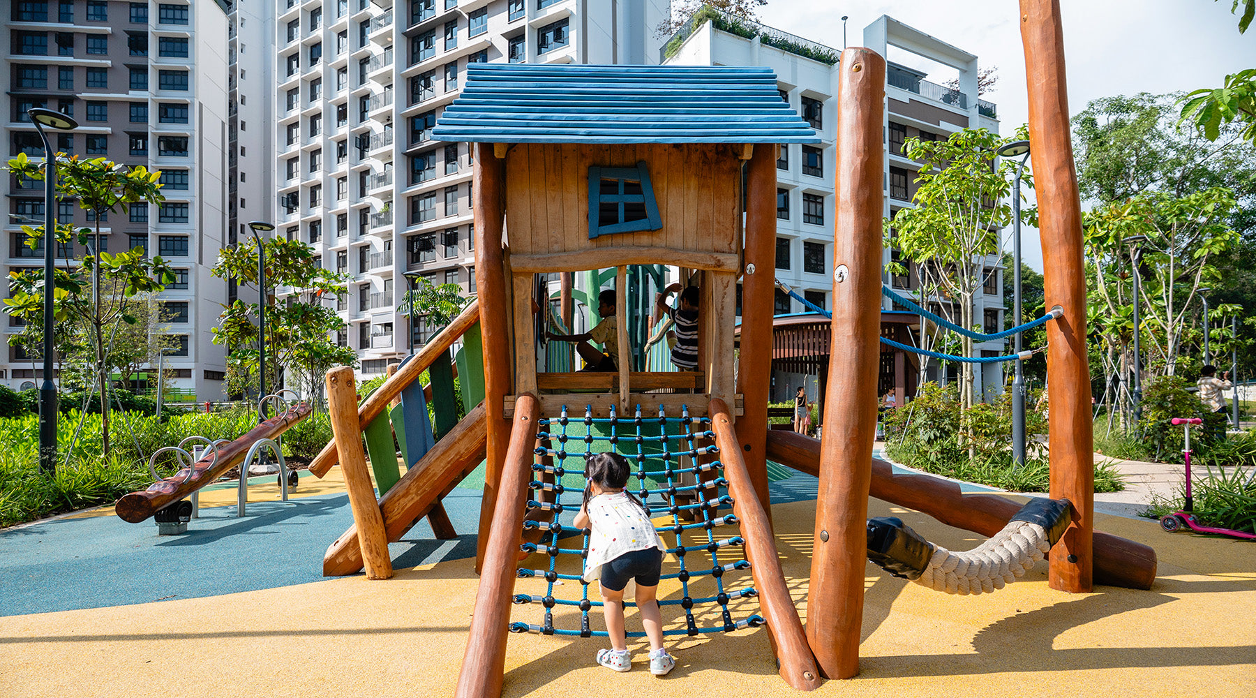 Punggol Point Crown nature-themed playground with rope climbing, balancing rope and see-saw for active outdoor play.