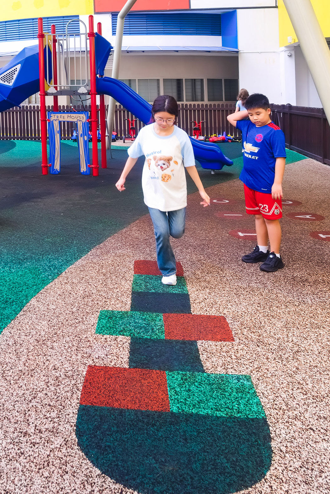 EPDM surface with hopscotch layout, promoting active play and safety for children in the playground.