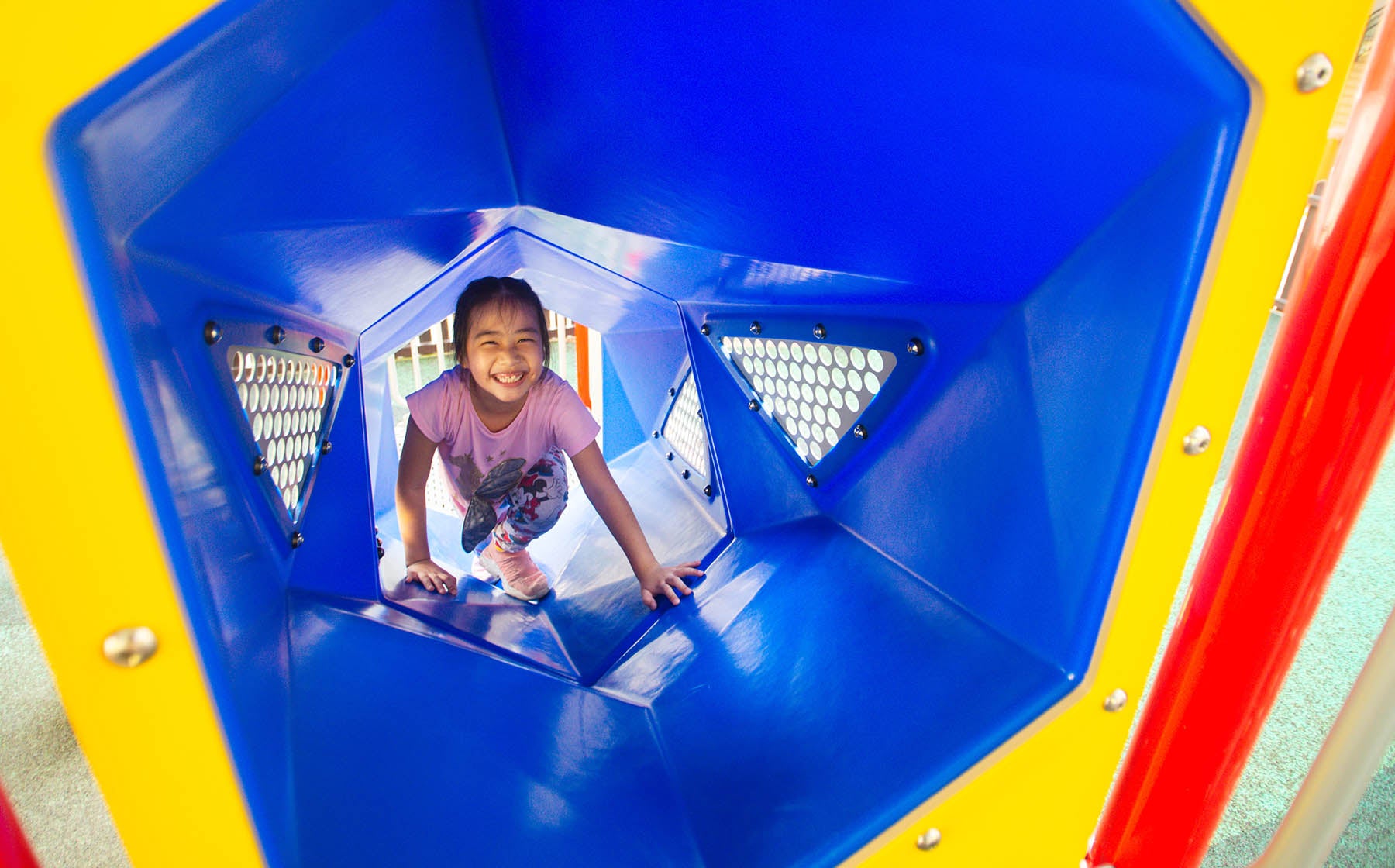 Playworld playground tunnel invites children to crawl and explore, enhancing physical activity and imagination.
