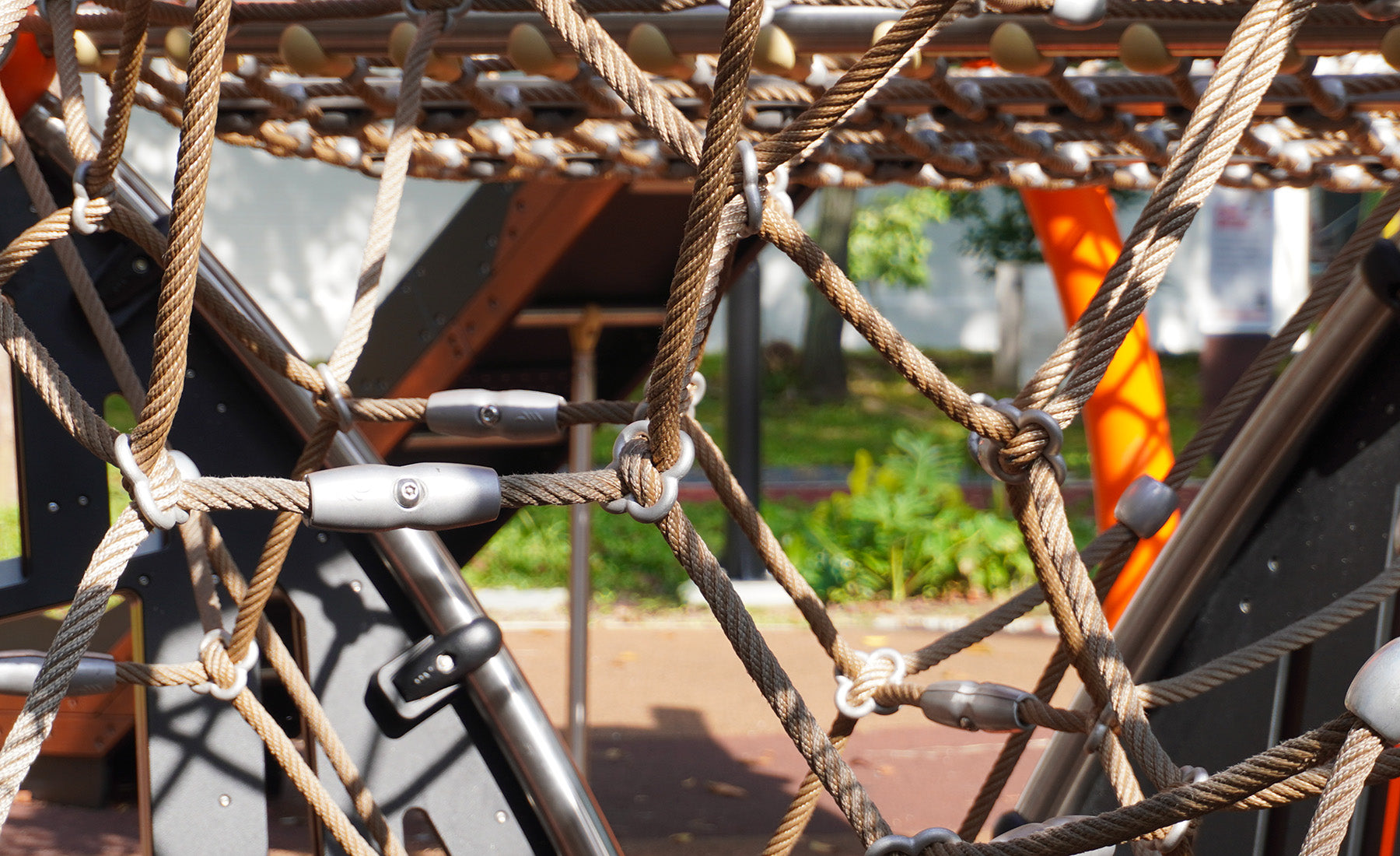 Berliner's cloverleaf rope connection system secures net intersections without welding for enhanced playground safety.