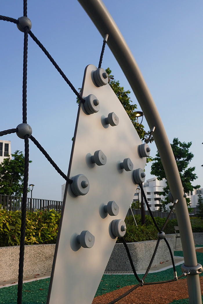 Tengah Parc Clover playground features a safe climbing structure with nets and secure hand grips for active children.