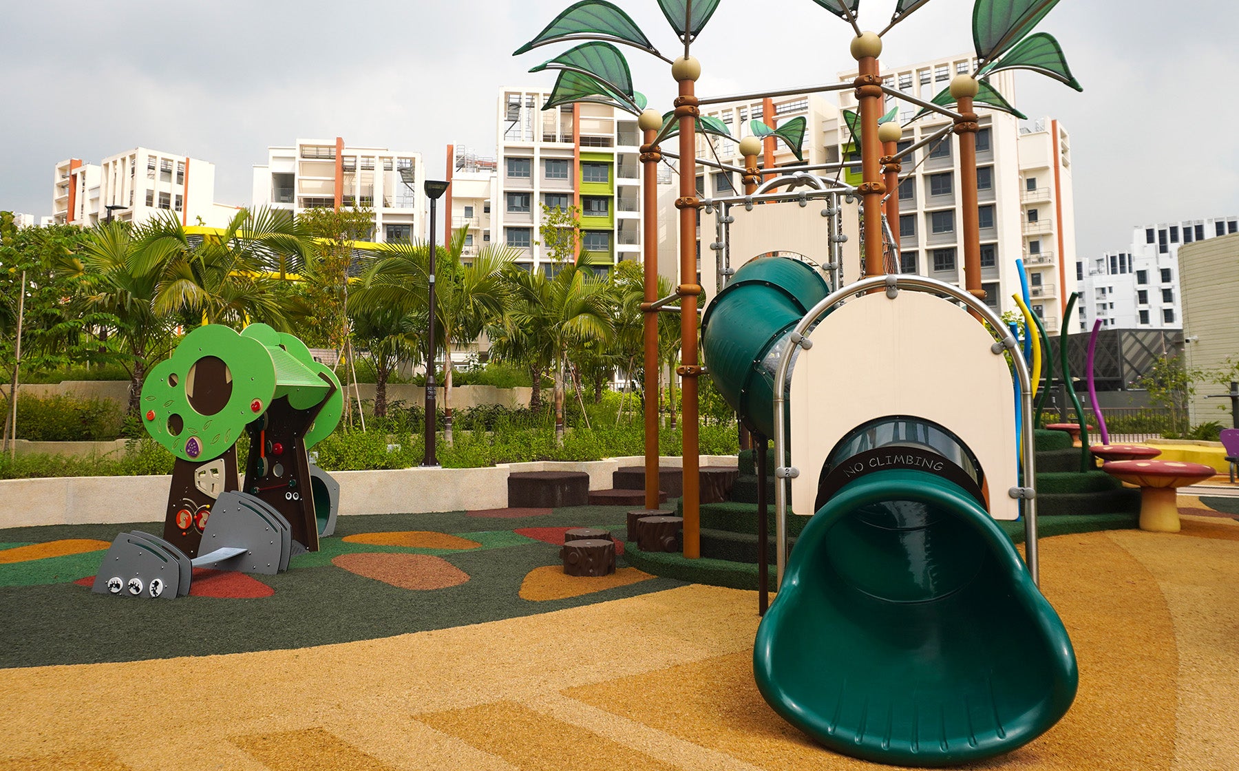 Parc Point playground features the Silly Tree playhouse for young children and a rope climbing tower for older kids.
