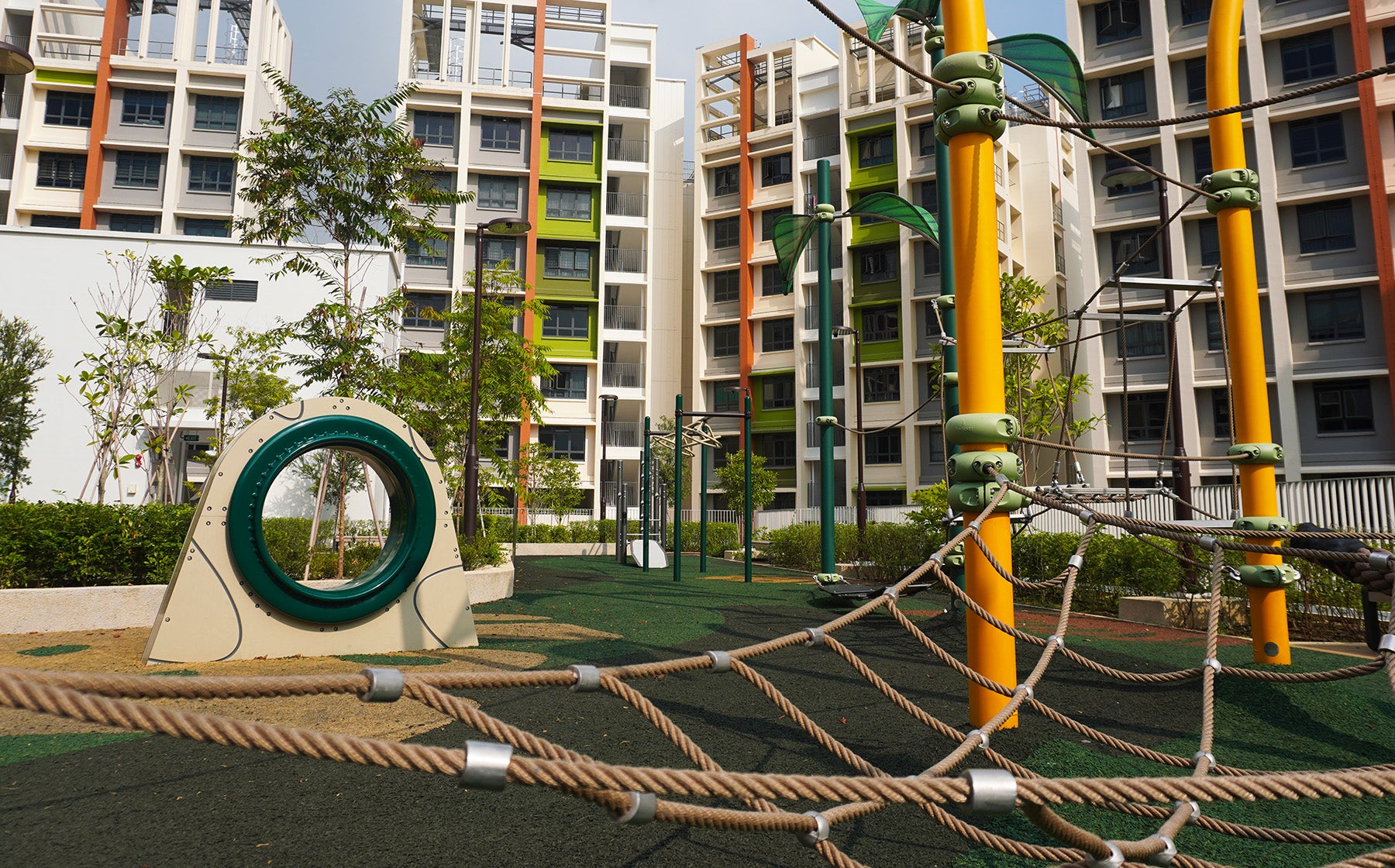 Parc Residences @ Tengah playground features a rope obstacle course and rotating ring for active climbing and spinning fun.