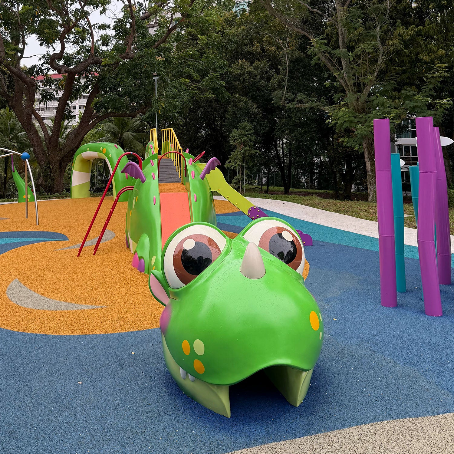 Sea Shell Park playground featuring Sea Dragon Playground with slides, climbers, and anemone-themed play poles.
