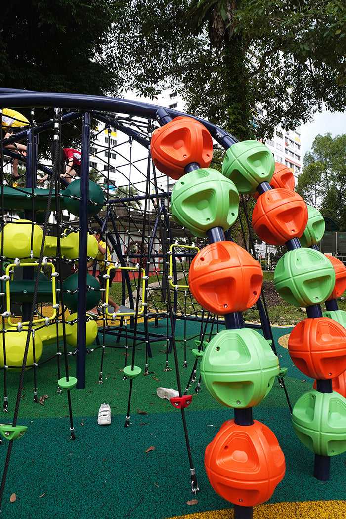 Playground climber with orb-shaped handholds that build children’s coordination, balance and spatial judgement.