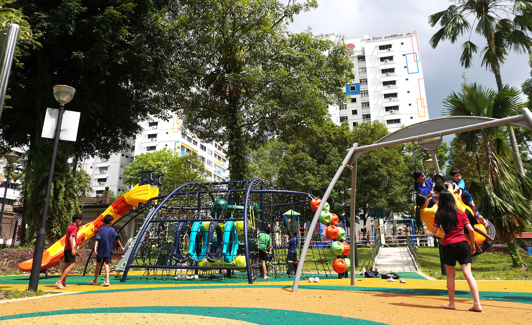 Teck Whye Garden playground features a dome-shaped climbing structure and a bell swing for safe, fun, and dynamic play.