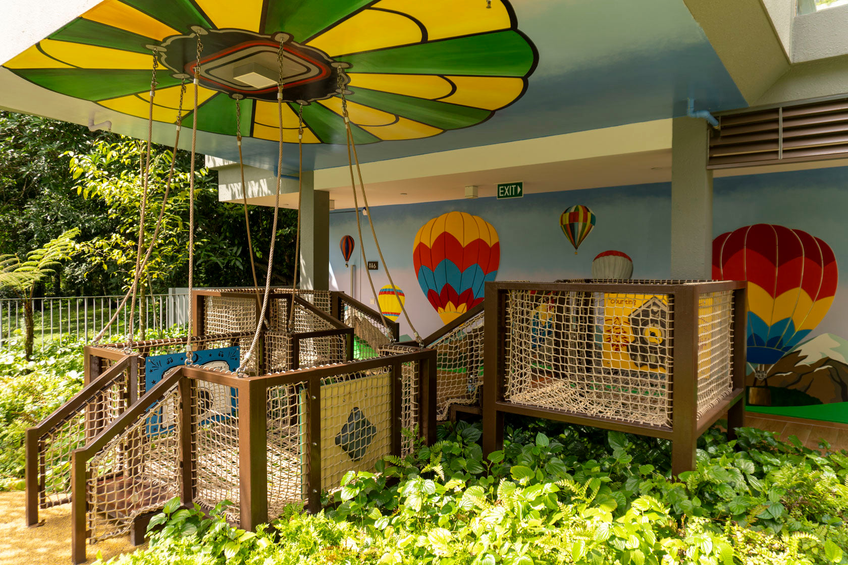 A playground with climbing elements and a hot air balloon design, offering fun and adventure for children to explore and play.