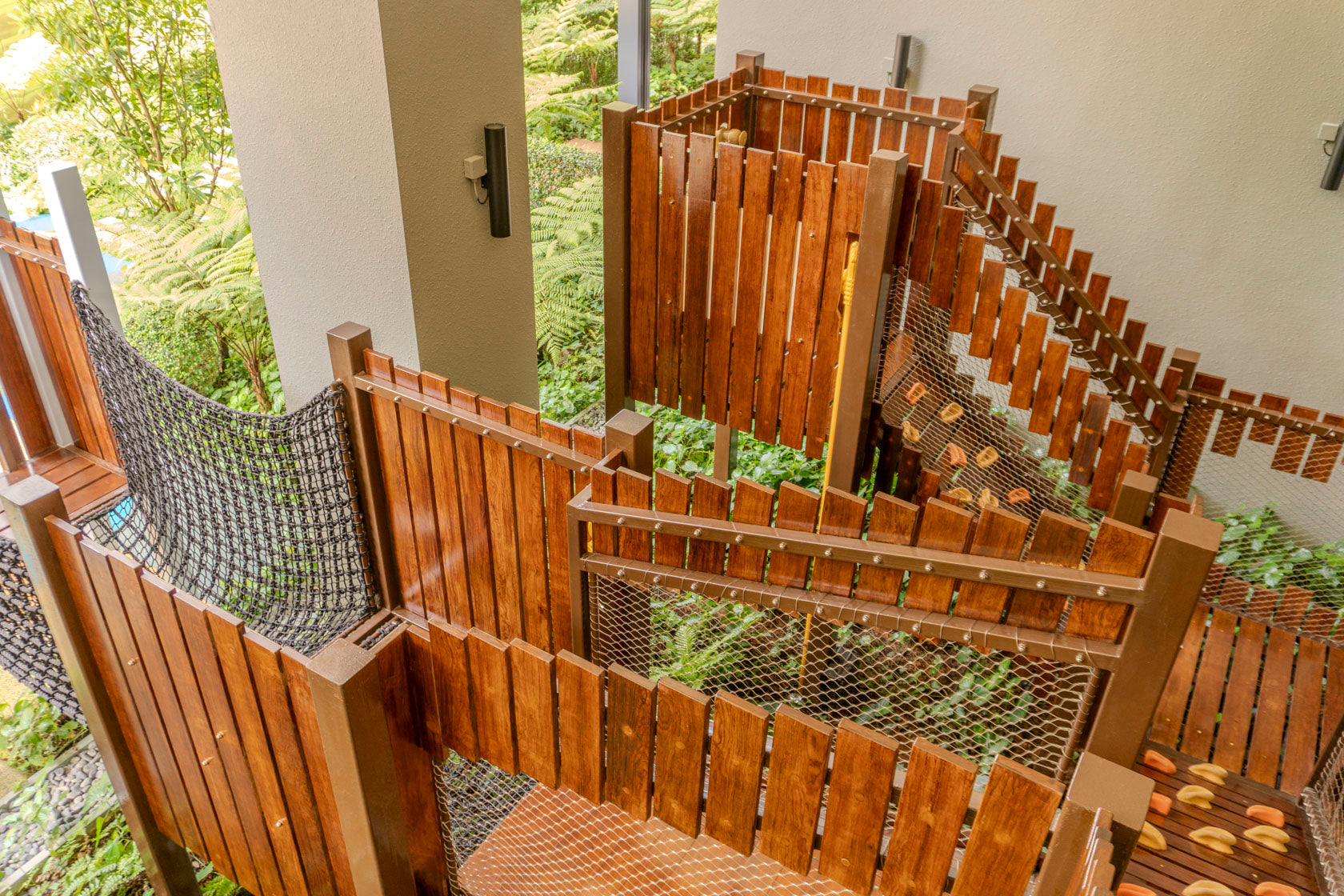 A playground with various climbing elements, including ropes, ladders, and structures, offering fun and adventure for children.