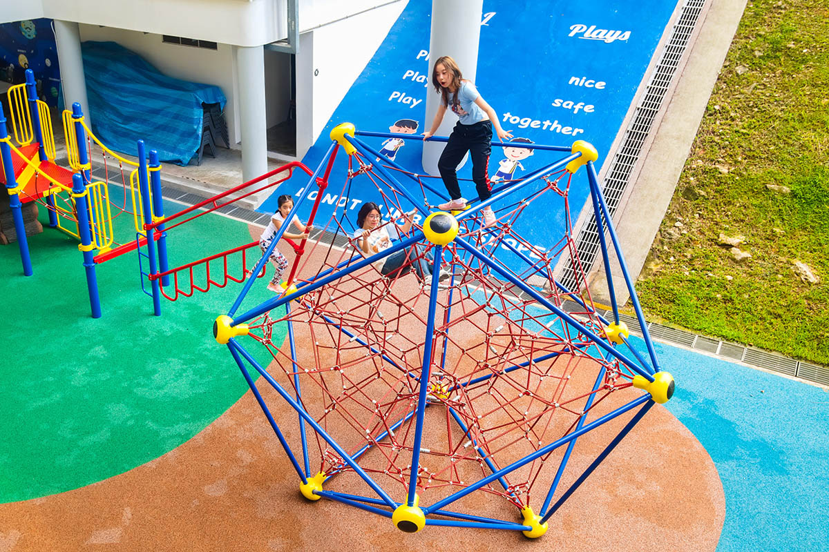 ACS (Junior) playground with Berliner Spaceball, Playworld play panels, and climbers for safe, fun, and active play.