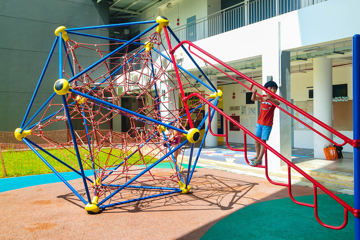 ACS (Junior) playground with Berliner Spaceball, Playworld play panels, and climbers for safe, fun, and active play.