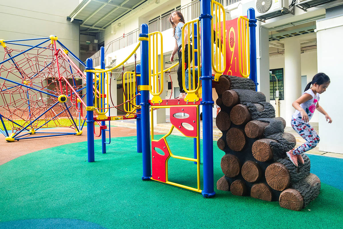 ACS (Junior) playground with Berliner Spaceball, Playworld play panels, and climbers for safe, fun, and active play.