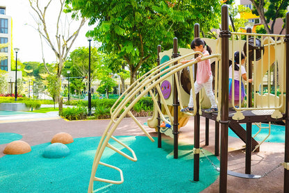 The girl is carefully stepping on the steps, holding the side poles to steady herself and prevent falling.