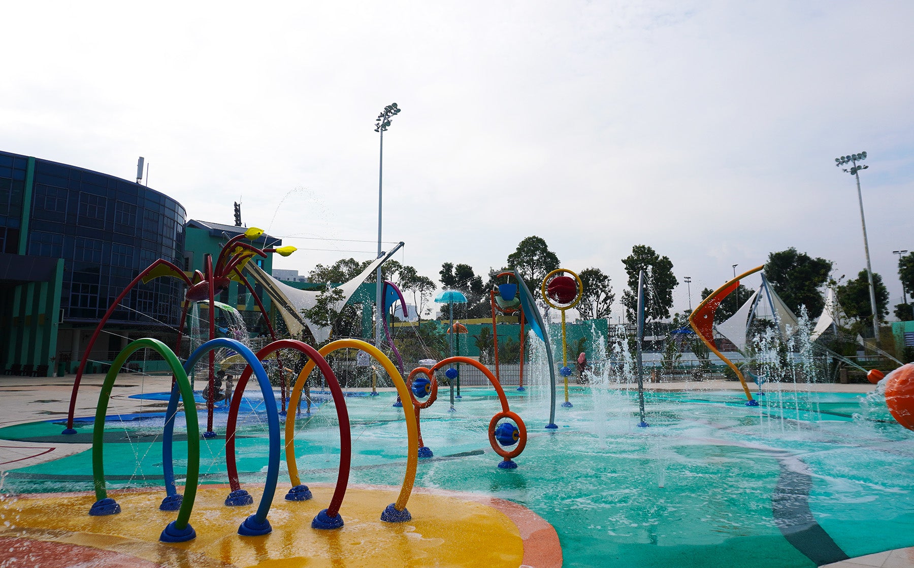 Jurong East Swimming Complex has top water playground equipment featuring spray arches and interactive splash pads.