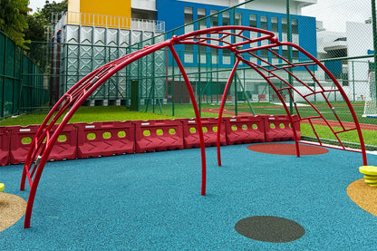 Jurong Primary School playground features an arched bar climber to challenge students' strength and coordination safely.